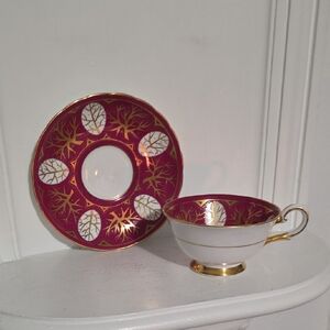 This is a vintage Royal Tuscan Fine Bone China "Olympus" pattern England